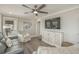 Relaxing living room featuring comfortable seating, a large TV, and hardwood floors at 6001 - E8 S Kings Hwy., Myrtle Beach, SC 29575