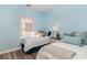 Charming bedroom with light blue walls and twin beds at 6015 Catalina Dr. # 932, North Myrtle Beach, SC 29582