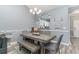 Bright dining room features a rustic wood table with bench seating at 6015 Catalina Dr. # 932, North Myrtle Beach, SC 29582