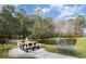 Peaceful pond with a picnic area and benches nearby at 6015 Catalina Dr. # 932, North Myrtle Beach, SC 29582