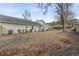 Spacious backyard with a large tree at 603 Plantation Dr., Surfside Beach, SC 29575