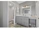 Modern bathroom with gray vanity and a shower at 603 Plantation Dr., Surfside Beach, SC 29575