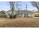 Charming one-story house with gray siding, landscaped lawn, and attached garage at 603 Plantation Dr., Surfside Beach, SC 29575