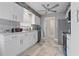 Modern kitchen with white cabinets and a center island at 603 Plantation Dr., Surfside Beach, SC 29575