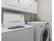 Laundry room with Whirlpool washer and dryer at 603 Plantation Dr., Surfside Beach, SC 29575