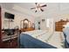 Comfortable bedroom with hardwood floors and a ceiling fan at 648 Twinflower Dr., Little River, SC 29566