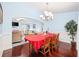 Elegant dining room with hardwood floors and a chandelier at 648 Twinflower Dr., Little River, SC 29566