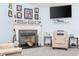 Living room fireplace with a flatscreen TV above the mantel at 648 Twinflower Dr., Little River, SC 29566