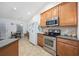 Well-equipped kitchen with ample counter space and wood cabinets at 648 Twinflower Dr., Little River, SC 29566