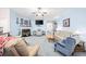 Light-filled living room with a fireplace and comfortable furniture at 648 Twinflower Dr., Little River, SC 29566