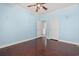 Bedroom with hardwood floors, light blue walls and ceiling fan at 6803 E Highway 19, Loris, SC 29569