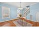 Bright dining room with hardwood floors and light blue walls at 6803 E Highway 19, Loris, SC 29569