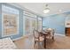 Charming dining area with light blue walls and hardwood floors at 6803 E Highway 19, Loris, SC 29569