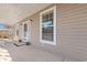 Inviting front porch with seating and potted plants at 6803 E Highway 19, Loris, SC 29569