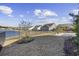 Backyard with pond view and landscaping at 692 Cherry Blossom Dr., Murrells Inlet, SC 29576