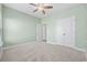 Light and bright bedroom with carpeted flooring and access to bathroom at 692 Cherry Blossom Dr., Murrells Inlet, SC 29576