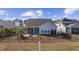 House exterior with screened porch and fenced backyard at 692 Cherry Blossom Dr., Murrells Inlet, SC 29576