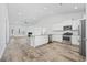 Modern kitchen with white cabinets, stainless steel appliances and granite countertops at 692 Cherry Blossom Dr., Murrells Inlet, SC 29576