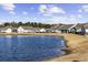 Community pond with houses in background at 692 Cherry Blossom Dr., Murrells Inlet, SC 29576