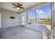 Screened porch with view of a pond and houses at 692 Cherry Blossom Dr., Murrells Inlet, SC 29576