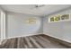 Grey walls, wood-look floors, and ceiling fan in this bedroom at 800 Egret Circle # 57, Little River, SC 29566