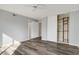 Bedroom with grey walls, wood-look flooring, and large closet at 800 Egret Circle # 57, Little River, SC 29566