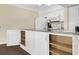 Open shelving in white kitchen with granite counters at 800 Egret Circle # 57, Little River, SC 29566