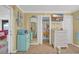 Beachy themed room showcases quirky decor, a view of the bathroom, and a wall-mounted TV at 820 9Th Ave. S, North Myrtle Beach, SC 29582