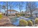 Landscaped pond with fountain in a beach house community at 820 9Th Ave. S, North Myrtle Beach, SC 29582