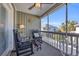 Cozy screened porch with rocking chairs, ideal for enjoying peaceful outdoor moments at 820 9Th Ave. S, North Myrtle Beach, SC 29582