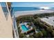 Aerial view showcasing pool, oceanfront location, and pier at 8560 Queensway Blvd. # 706, Myrtle Beach, SC 29572