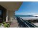 Balcony featuring green Adirondack chairs and table facing sunny ocean and pier view at 8560 Queensway Blvd. # 706, Myrtle Beach, SC 29572