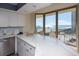 Bright kitchen with quartz countertops, a breakfast bar, and stunning ocean views through the large windows at 8560 Queensway Blvd. # 706, Myrtle Beach, SC 29572