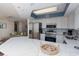 Bright kitchen with stainless appliances, quartz countertops, breakfast bar and opens to the living room at 8560 Queensway Blvd. # 706, Myrtle Beach, SC 29572