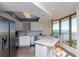 Bright kitchen with stainless appliances, quartz countertops, breakfast bar and stunning ocean views at 8560 Queensway Blvd. # 706, Myrtle Beach, SC 29572