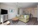 Cozy living room featuring modern decor, comfortable seating, and a ceiling fan at 8560 Queensway Blvd. # 706, Myrtle Beach, SC 29572
