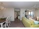 Open concept living and dining area featuring hardwood floors, modern decor, and comfortable seating at 8560 Queensway Blvd. # 706, Myrtle Beach, SC 29572