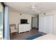 Bright main bedroom with modern white dresser, chair, and large closet at 8560 Queensway Blvd. # 706, Myrtle Beach, SC 29572
