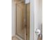 Bathroom showcasing glass-enclosed tiled shower with showerhead, and accessible toilet paper roll at 8560 Queensway Blvd. # 706, Myrtle Beach, SC 29572