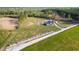 Aerial view of a spacious property featuring a pool, multiple outbuildings, and green land at 926 Eula Dr., Conway, SC 29526