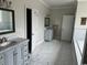 Spacious bathroom with dual vanities, marble floors, and soaking tub at 926 Eula Dr., Conway, SC 29526