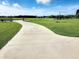 Long paved driveway surrounded by green grass leading to a beautiful home at 926 Eula Dr., Conway, SC 29526