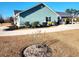 Side view of house showcasing landscaping and driveway at 926 Eula Dr., Conway, SC 29526