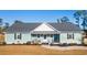 Single-story home with light teal siding, gray roof, and rocking chairs on the porch at 926 Eula Dr., Conway, SC 29526