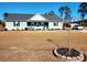 Single-story house with a circular garden bed at 926 Eula Dr., Conway, SC 29526