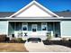 Covered porch with rocking chairs and a welcoming entrance at 926 Eula Dr., Conway, SC 29526