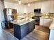 Well-equipped kitchen featuring white cabinets, stainless steel appliances, a tile backsplash, and a center island at 926 Eula Dr., Conway, SC 29526