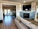 Open-concept living room with stone fireplace and built-in shelving at 926 Eula Dr., Conway, SC 29526