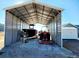 Large metal shed with boat and tractor parked on the gravel covered floor at 926 Eula Dr., Conway, SC 29526
