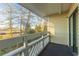 Cozy balcony features a scenic view of natural trees and wild vegetation at 1100 Possum Trot Rd. # H234, North Myrtle Beach, SC 29582